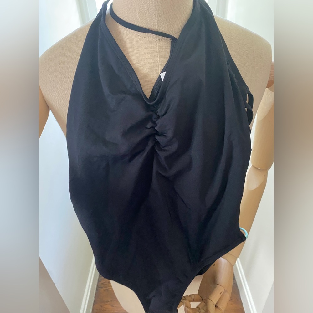 Sexy NWOT- one piece sexy black bathing suit w/ cutouts on back/side